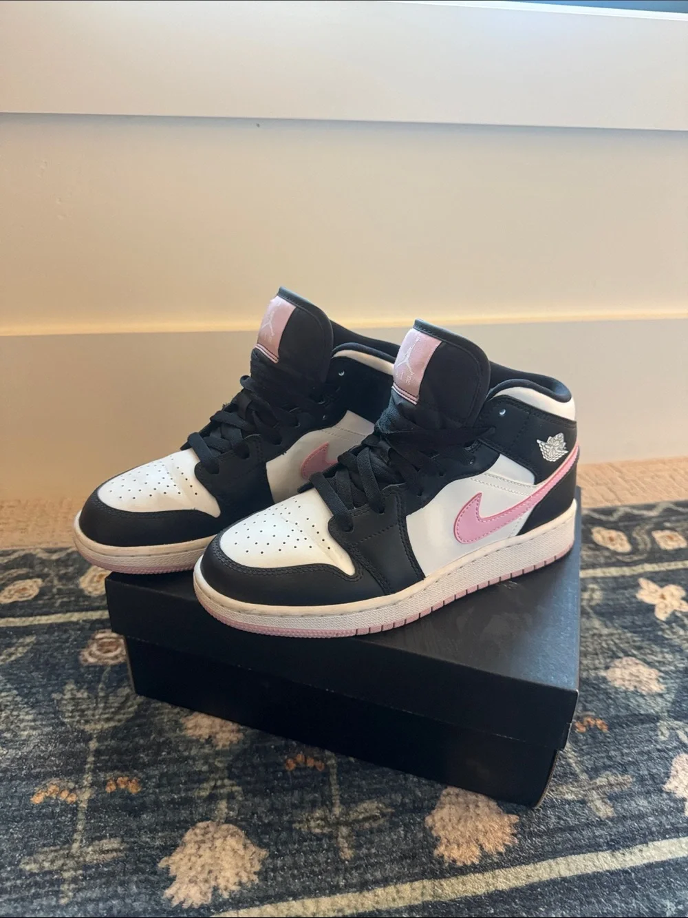 Nike Air Jordan 1 Mid High-Top Sneakers in Black, White & Pink